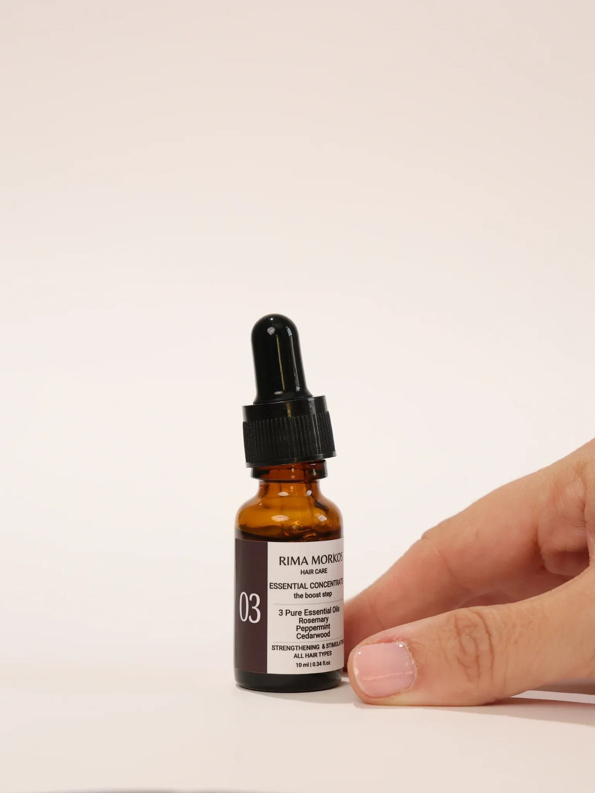 No 03 Essential Concentrate held in hand