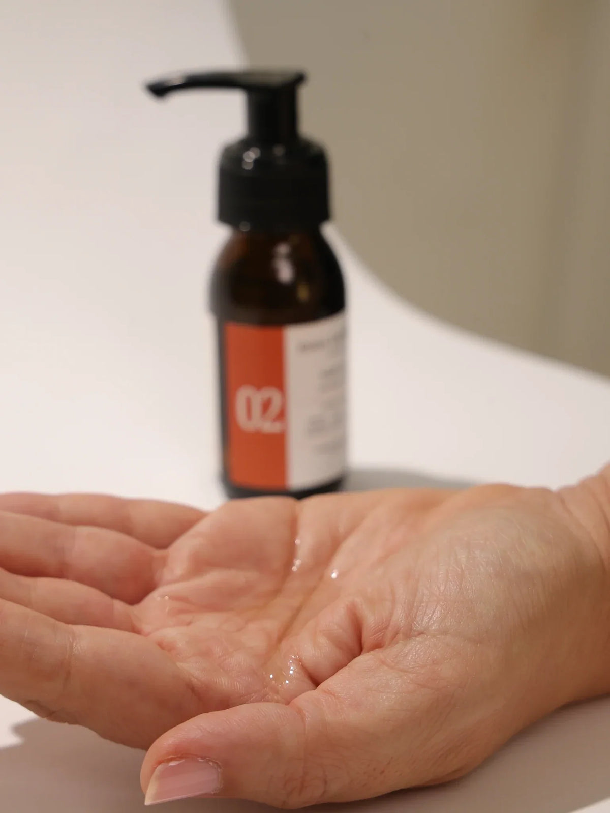 No 02 Pre-Wash Hair Oil texture in palm