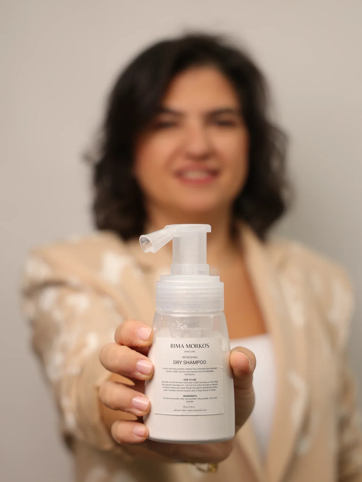 Rima Morkos holding Dry Shampoo