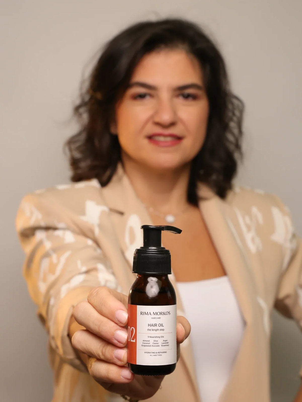 Rima Morkos holding No 02 Pre-Wash Hair Oil
